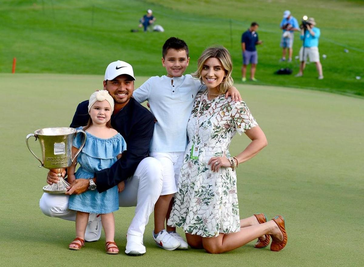 Wells Fargo Championship winner Jason Day poses with his family (left to right): daughter Lucy, son Dash and wife Ellie Harvey at Quail Hollow Club on Sunday.