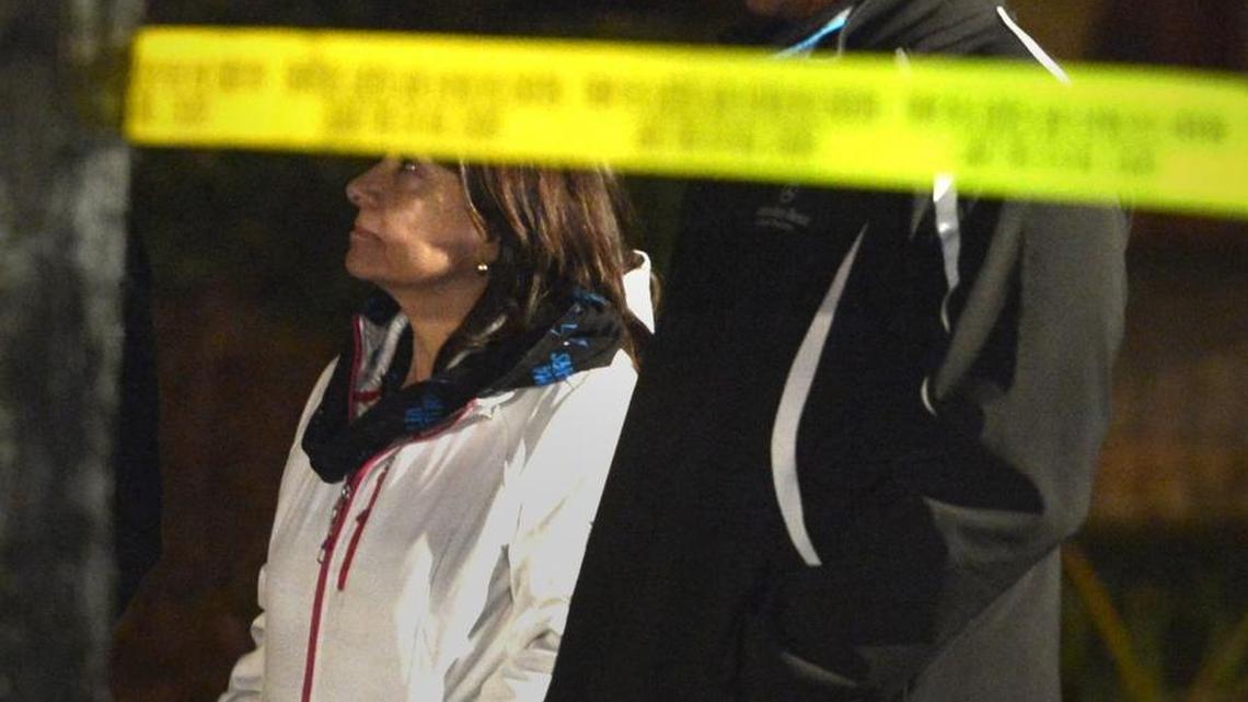 
Carolina Panthers coach Ron Rivera (right) stands outside his home as Charlotte firefighters battled a two-alarm fire at the home in early January. The house sustained about $500,000 worth of damage. The Rivera family moved back into the house in late July. 
