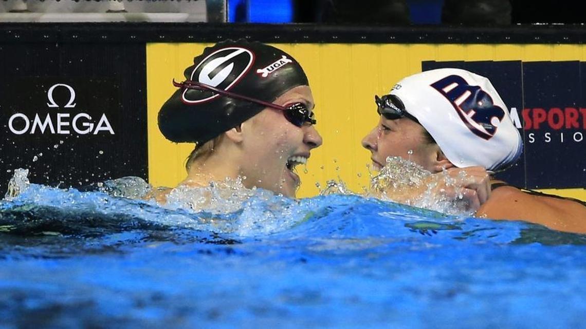 Kathleen Baker, right, celebrates with Olivia Smoliga after the women’s 100-meter backstroke final at the U.S. Olympic swimming trials in Omaha, Neb., Tuesday. Smoliga was first and Baker second, putting both on the U.S. team that will compete in Rio.