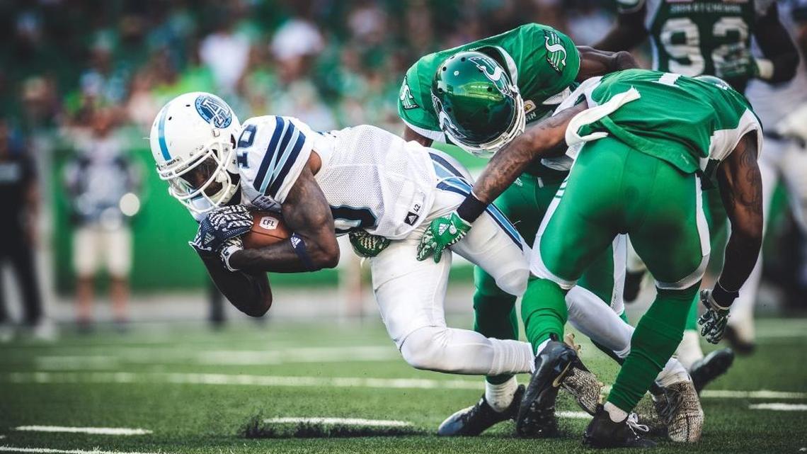 Armanti Edwards (10) of the Toronto Argonauts fights for extra yardage in a recent game against Saskatchewan. Edwards, a former star quarterback at Appalachian State, has found a home playing receiver in the Canadian Football League.