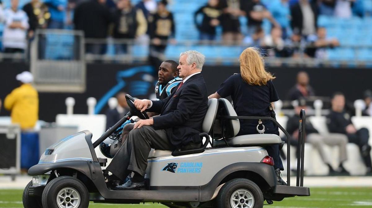 Carolina Panthers owner Jerry Richardson drives linebacker Thomas Davis back to the team tunnel before a game. Davis said Monday he has promised the 80-year-old Richardson that Carolina will win a Super Bowl and that he intends to keep that vow.