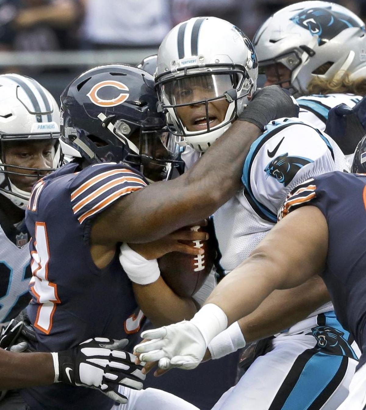 Chicago Bears linebacker Leonard Floyd, left, sacks Carolina Panthers quarterback Cam Newton during the first half Sunday.