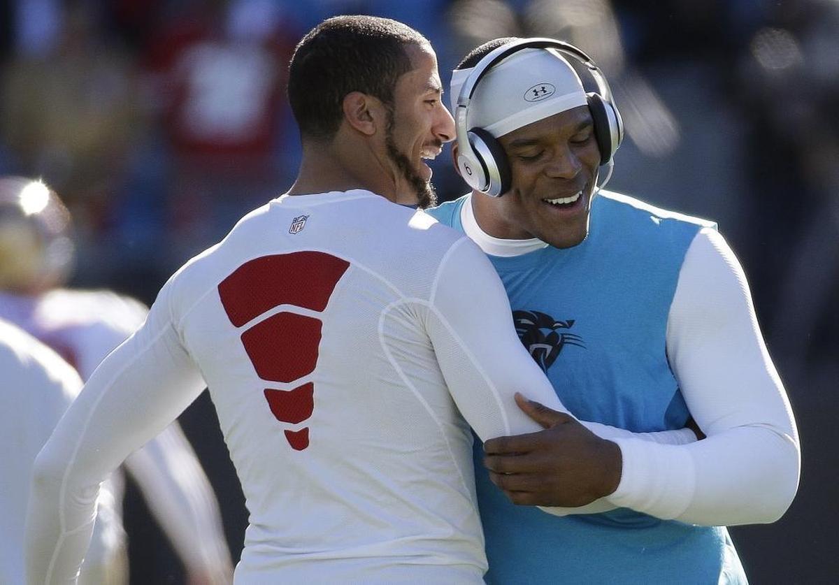 In 2014, San Francisco 49ers quarterback Colin Kaepernick and Cam Newton embraced before Newton’s first-ever playoff game. Kaepernick and the 49ers prevailed, 23-10.
