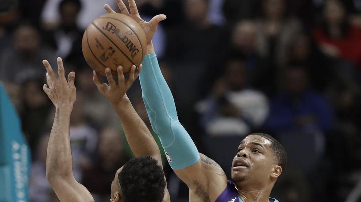 Charlotte rookie forward Miles Bridges, right, blocks a shot in the Hornets’ 101-92 win over the New York Knicks Monday night. Bridges scored 11 points and had eight rebounds.
