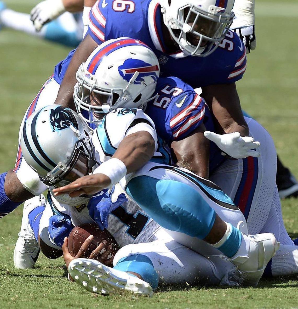 Carolina Panthers quarterback Cam Newton (1) had his left foot twisted on a sack from Buffalo defensive end Jerry Hughes (55) Sunday. The Panthers won, 9-3, and Newton did not miss a play but was noticeably limping both Sunday after the game and Monday.