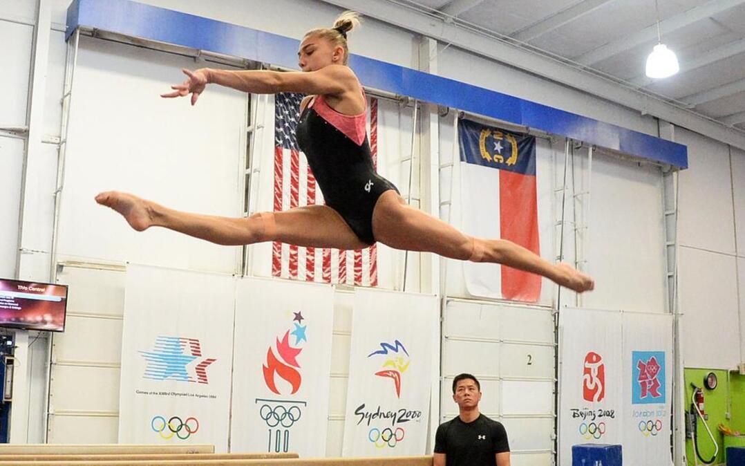 Gymnast Ashton Locklear, shown here in 2014 training on the balance beam at Everest Gymnastics in Huntersville, will try to make the Olympic gymnastics team this weekend.