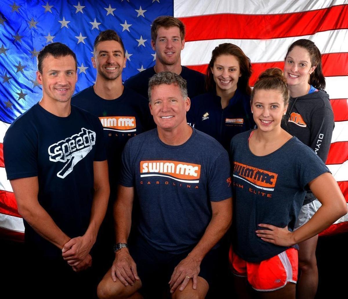 David Marsh (center) was surrounded by his six Team Elite Olympic team members for this 2016 shoot. Marsh was the head coach of the U.S. women’s Olympic swim team in 2016.