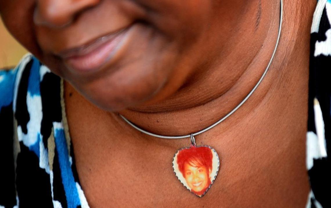 Saundra Adams frequently wears a necklace with a photo of her daughter, Cherica Adams. Cherica Adams died as a result of four gunshot wounds in 1999, but her son, Chancellor Lee Adams, survived. The picture of Cherica enclosed in the necklace was taken only a few days before she was shot.