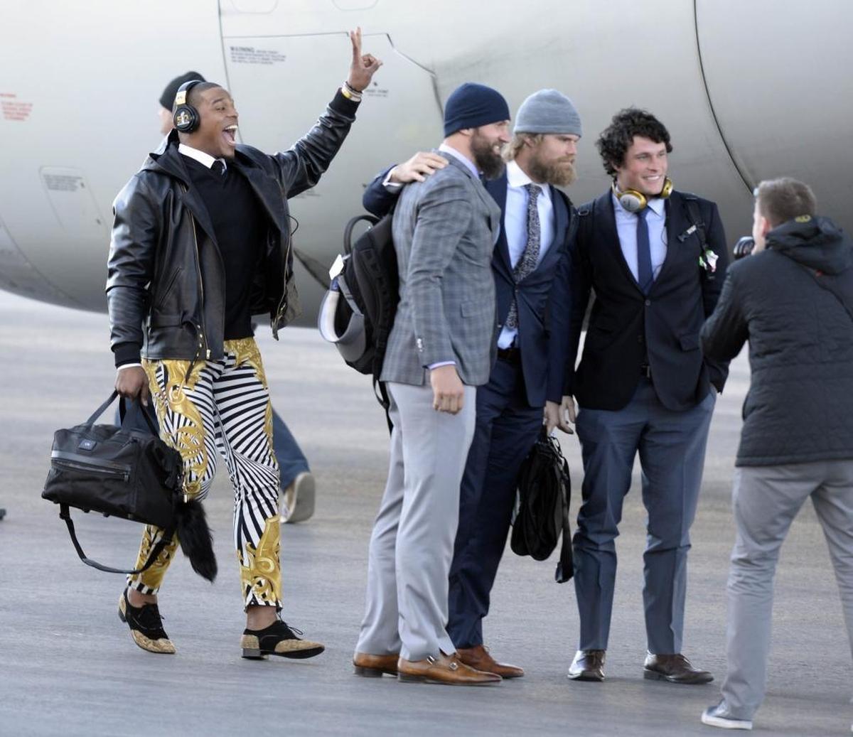 Cam Newton, left, photobombed Luke Kuechly (right) and teammates Derek Anderson and Greg Olsen in 2016 before the Super Bowl.