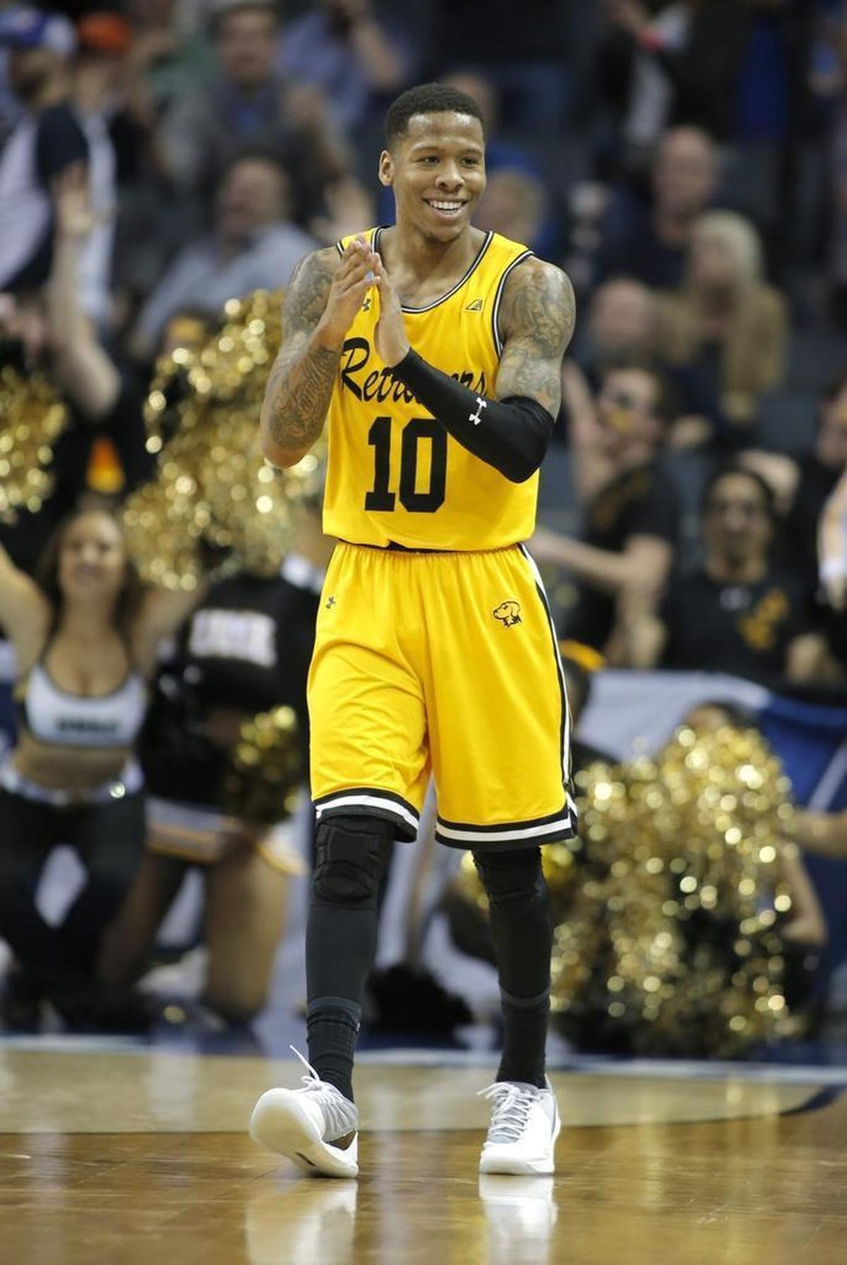UMBC’s Jairus Lyles celebrates during the second half of the team's first-round upset over Virginia Friday in Charlotte. Lyles scored 28 points in UMBC’s upset win.