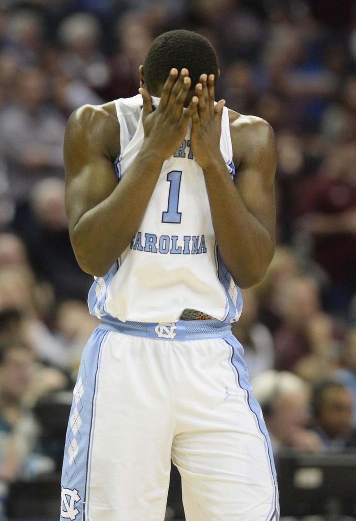 North Carolina Tar Heels forward Theo Pinson (1) uses his jersey to wipe his face late in the game against Texas A&M Sunday. Texas A&M won 86-65 in what would be the last game of Pinson’s career as a Tar Heel.