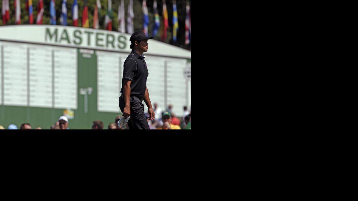 
Amateur Gunn Yang, of South Korea, walks past the leader board during a practice round for the Masters golf tournament Wednesday. At Augusta, the scoreboards are part of the simplicity, and the beauty, of a world without cell phones. 
