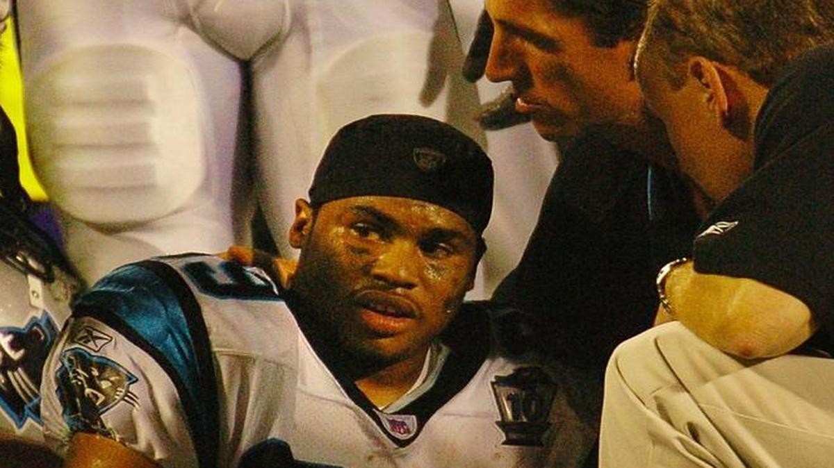 Carolina Panthers wide receiver Steve Smith sits on the field after being injured in a game against the Green Bay Packers on Sept. 13, 2004.