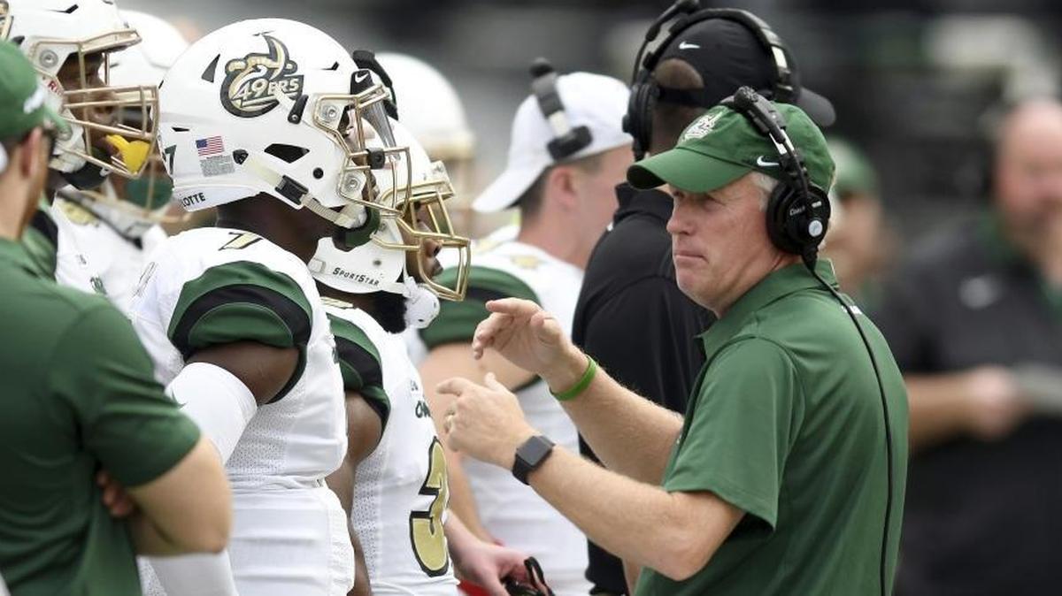 Brad Lambert (right) was just the guy to launch a football program at Charlotte, but is he still the guy to lead the 49ers at the BCS level?