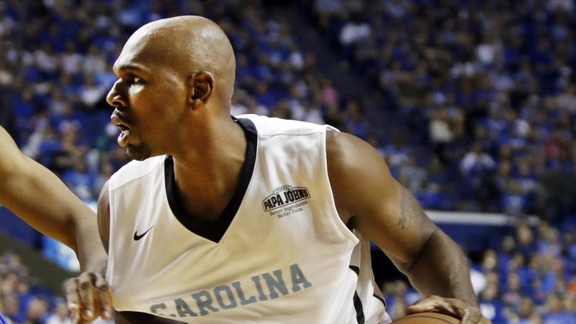 Former North Carolina basketball player Jerry Stackhouse, right, drives against a squad of former Kentucky players during a 2015 basketball fund-raiser in Lexington, Ky. Stackhouse is among the names being mentioned for the open Charlotte Hornets coaching position.