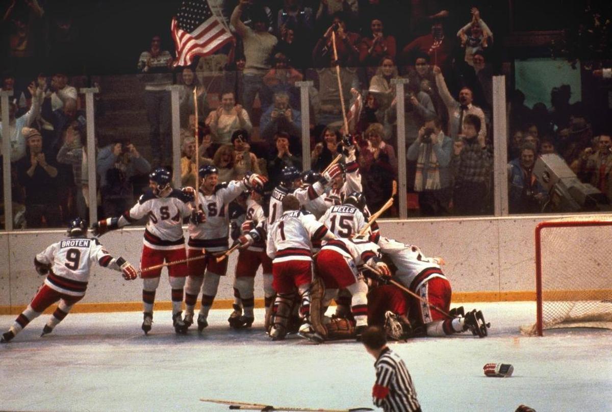 My favorite Winter Olympics moment was in 1980, when the U.S. hockey team beat the Soviets 4-3. Above, the American squad pounces on goalie Jim Craig after the win at Lake Placid, N.Y.