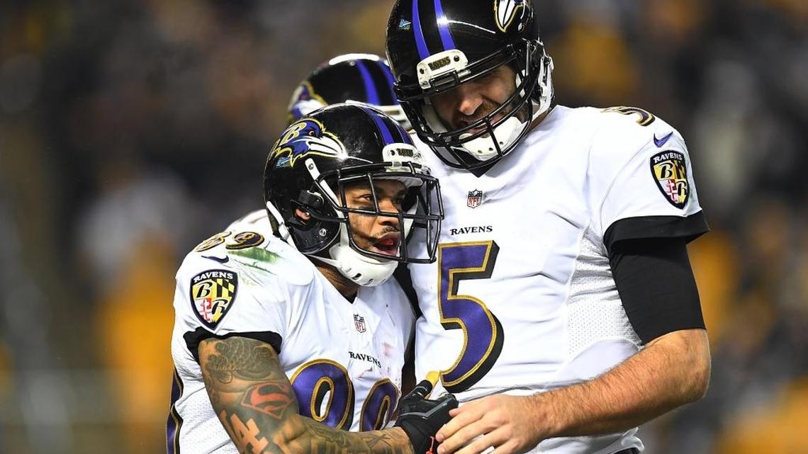 Steve Smith (left) of the Baltimore Ravens celebrates his 18-yard touchdown reception with Joe Flacco against the Pittsburgh Steelers at Heinz Field on Christmas Day.