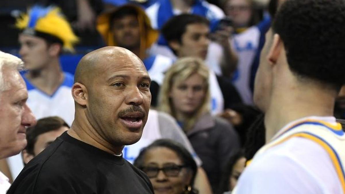 UCLA guard Lonzo Ball, right, shakes hands with his father, LaVar, on March 4 in Los Angeles. The celebrity father has become famous for all the wrong reasons.