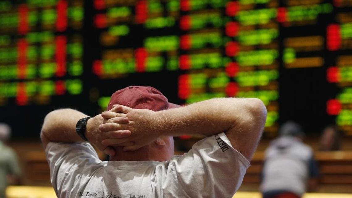 A man watches a baseball game in the sports book in a Las Vegas hotel. The Supreme Court in 2018 gave its go-ahead for states to allow gambling on sports across the nation, striking down a federal law that barred betting on football, basketball, baseball and other sports in most states.