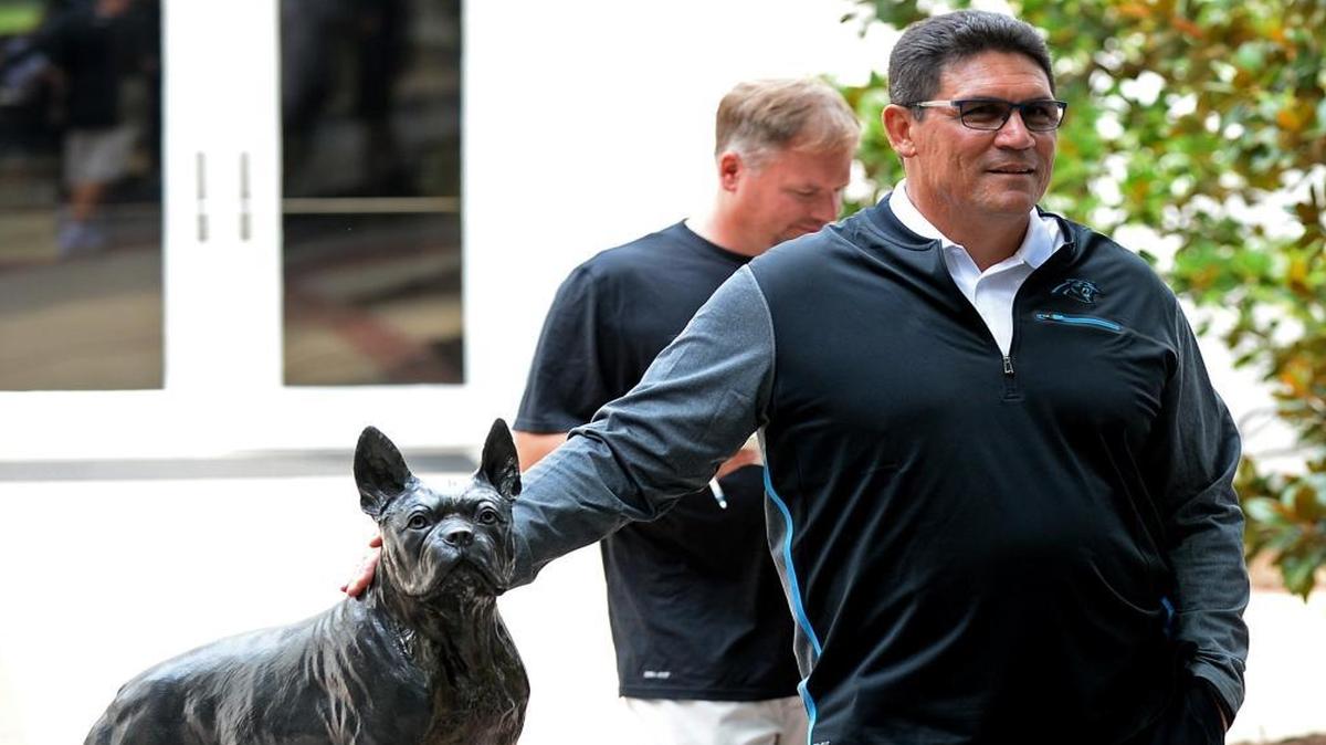 Carolina Panthers head coach Ron Rivera stops and watches the gathering of media near the terrier statue on the campus of Wofford College in Spartanburg. Fans can only hope 2017 isn’t another dog.