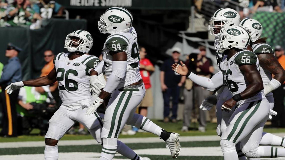 New York Jets defensive end Kony Ealy, second from left, celebrates his interception with Marcus Maye, left, and others on Sunday. If Ealy ever finds consistency ...
