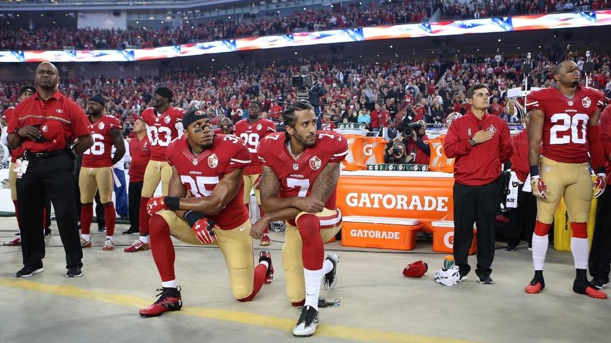 San Francisco 49ers Eric Reid (35) and Colin Kaepernick (7) can take a knee during the national anthem on Sunday in Charlotte if they want. How you act is more important.