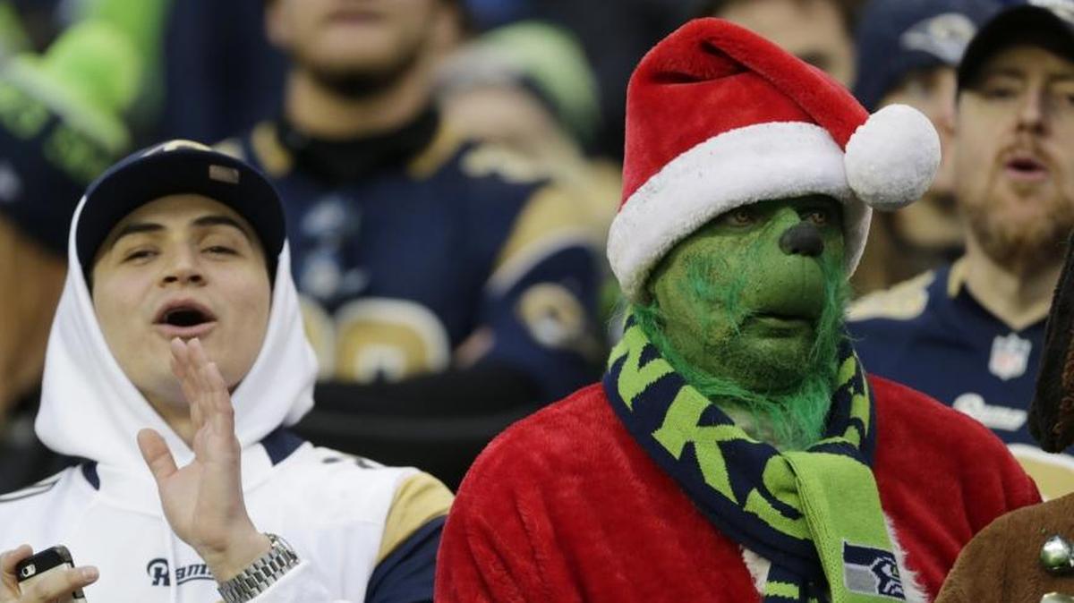 I had one really dumb loss. I picked the Seattle Seahawks to beat the Los Angeles Rams. The game is in Seattle, the stadium and fans, like the one at right, make winning difficult for visitors, and the Seahawks have to win. But the Seattle team I picked stopped playing in 2013.