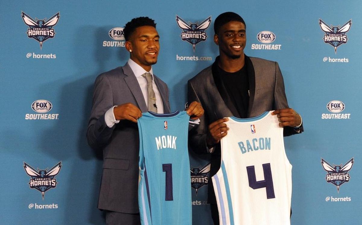 Charlotte Hornets 2017 draft picks Malik Monk, left, and Dwayne Bacon hold up their jerseys at the end of a press conference at the Spectrum Center on Friday.