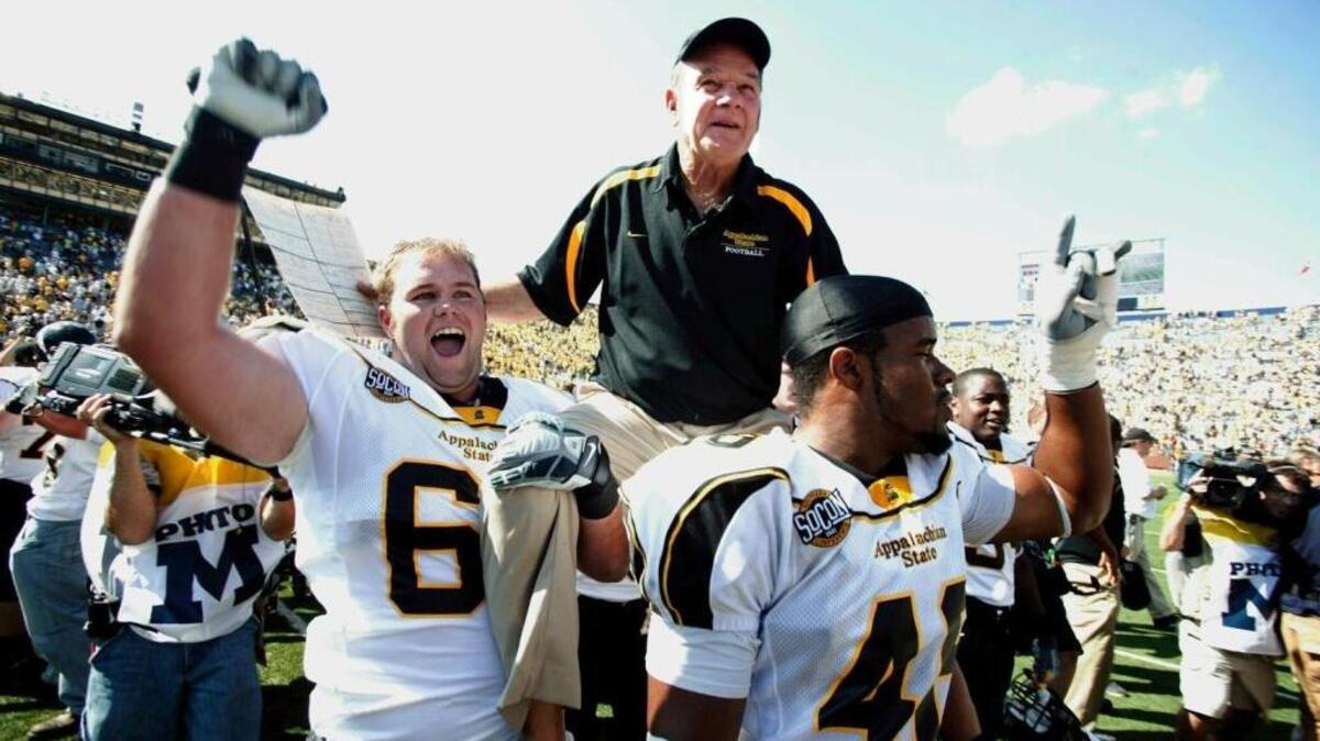 Appalachian State head coach Jerry Moore is lifted on the shoulder of his players moments after a 34-32 upset win over Michigan at Michigan Stadium in Ann Arbor, Mich., on Saturday, September 1, 2007.