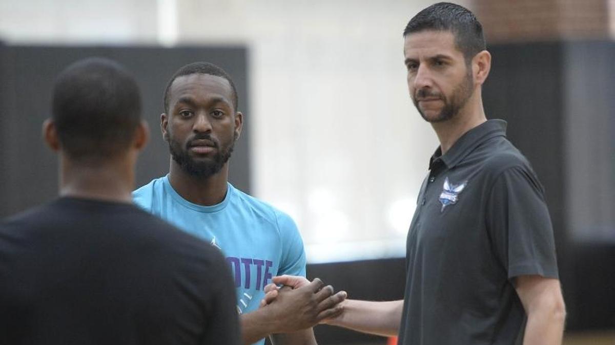 New Charlotte Hornets coach James Borrego (right, conferring with point guard Kemba Walker) says he’ll demand quick, decisive ball-movement from his new team. Last season, the Hornets were just 24th among 30 NBA teams in average assists.