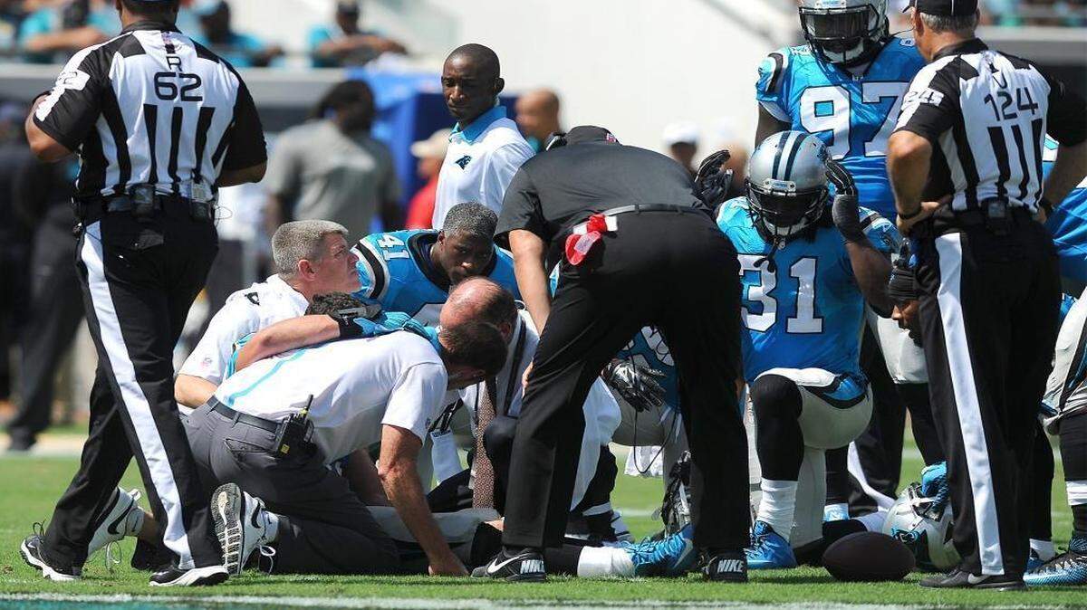 
Team personnel surround Carolina Panthers linebacker Luke Kuechly (59) on Sunday, September 13, 2015 at EverBank Field in Jacksonville, Fl. Kuechly sustained a concussion on the play and is now in the NFL's concussion protocol. 
