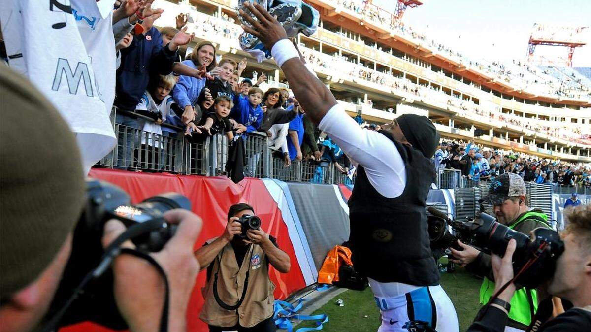 Carolina Panthers fans traveled well to Tennessee, and quarterback Cam Newton rewarded them by tossing his cleats and jersey into the stands following a 27-10 victory over the Titans at Nissan Stadium in Nashville.