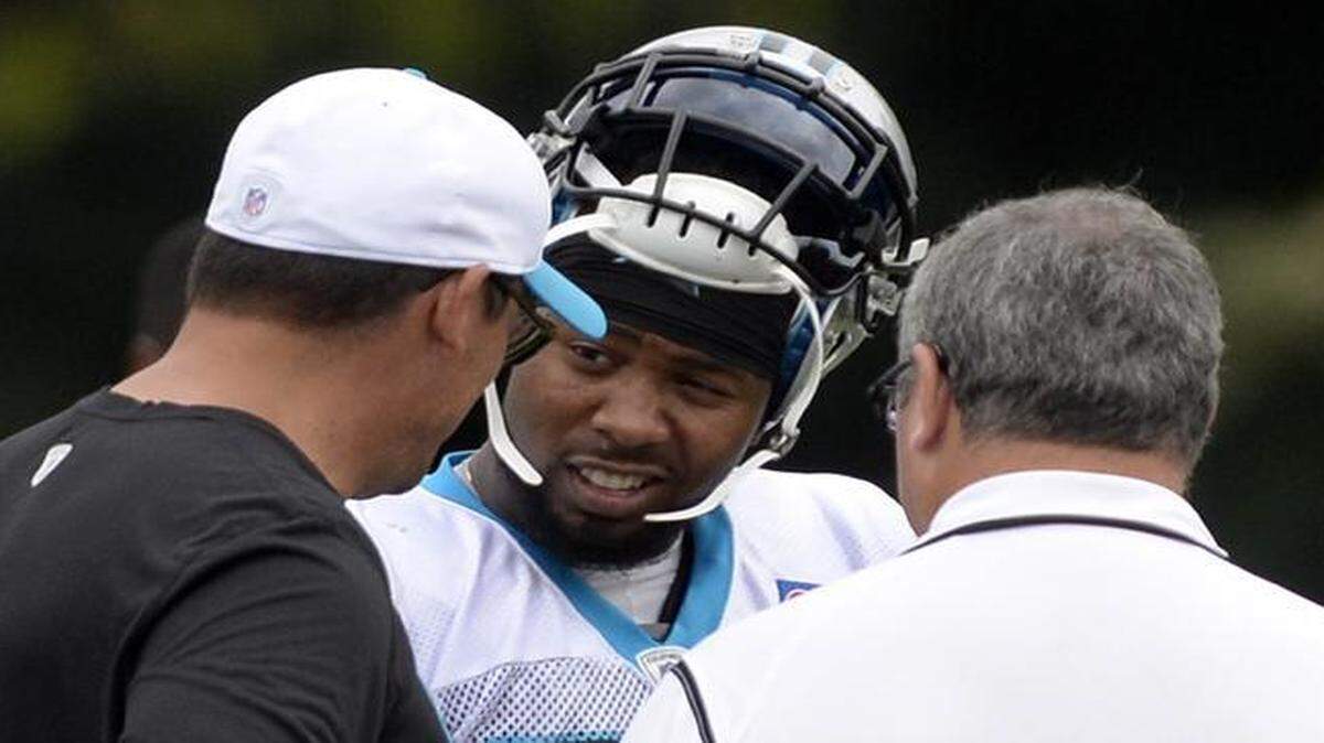 
Carolina Panthers cornerback Josh Norman talks with head coach Ron Rivera and general manager Dave Gettleman after practice during training camp at Wofford College in Spartanburg. Norman got into a heated scuffle with Panthers quarterback Cam Newton earlier in practice.
