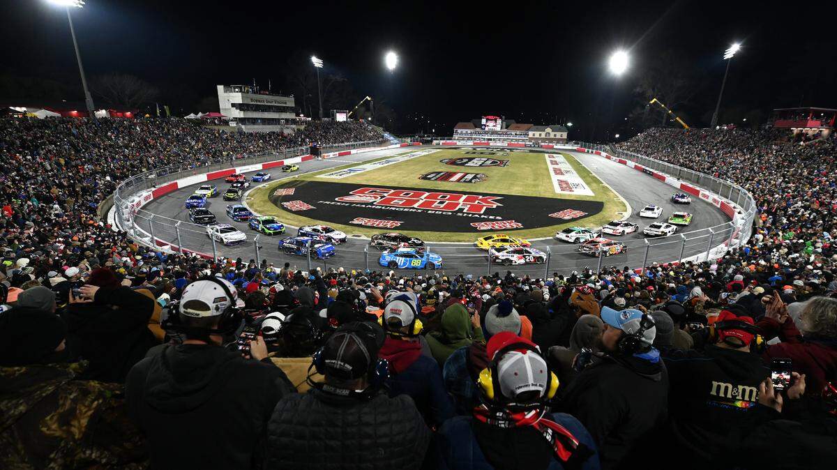 NASCAR fans watch the field pass between Turns 1 and 2 during the Cook Out Clash race at Bowman Gray Stadium in Winston-Salem, NC on Sunday, February 2, 2025. Driver Chase Elliott won the race.