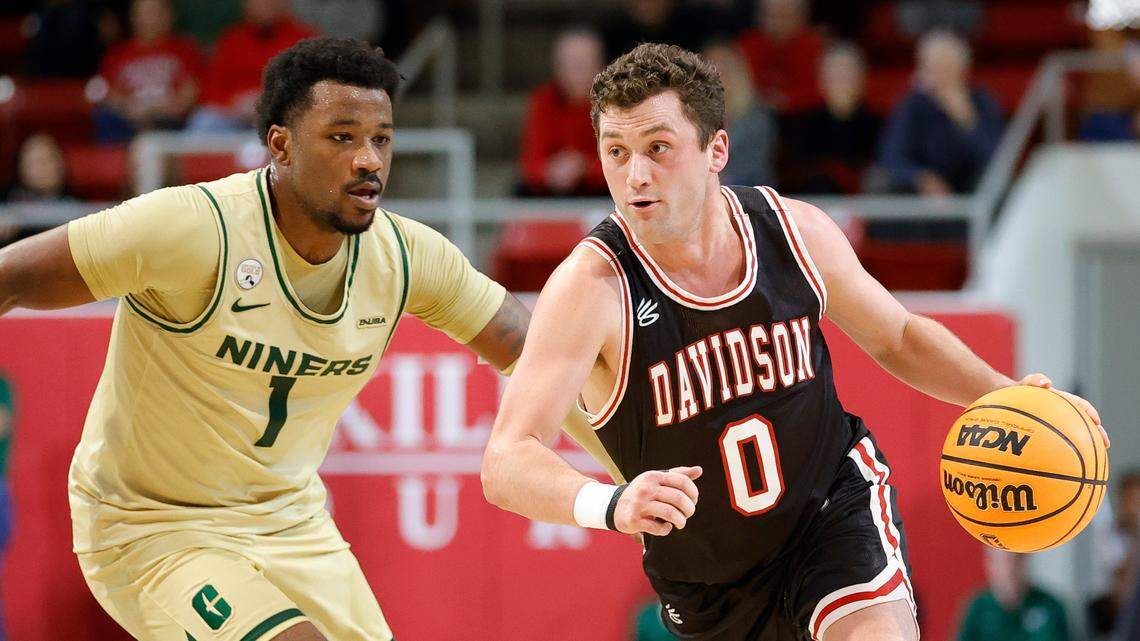 Davidson Wildcats guard Foster Loyer (0) dribbles around Charlotte 49ers guard Montre’ Gipson (1) during a game at Belk Arena in Davidson on Nov. 29.