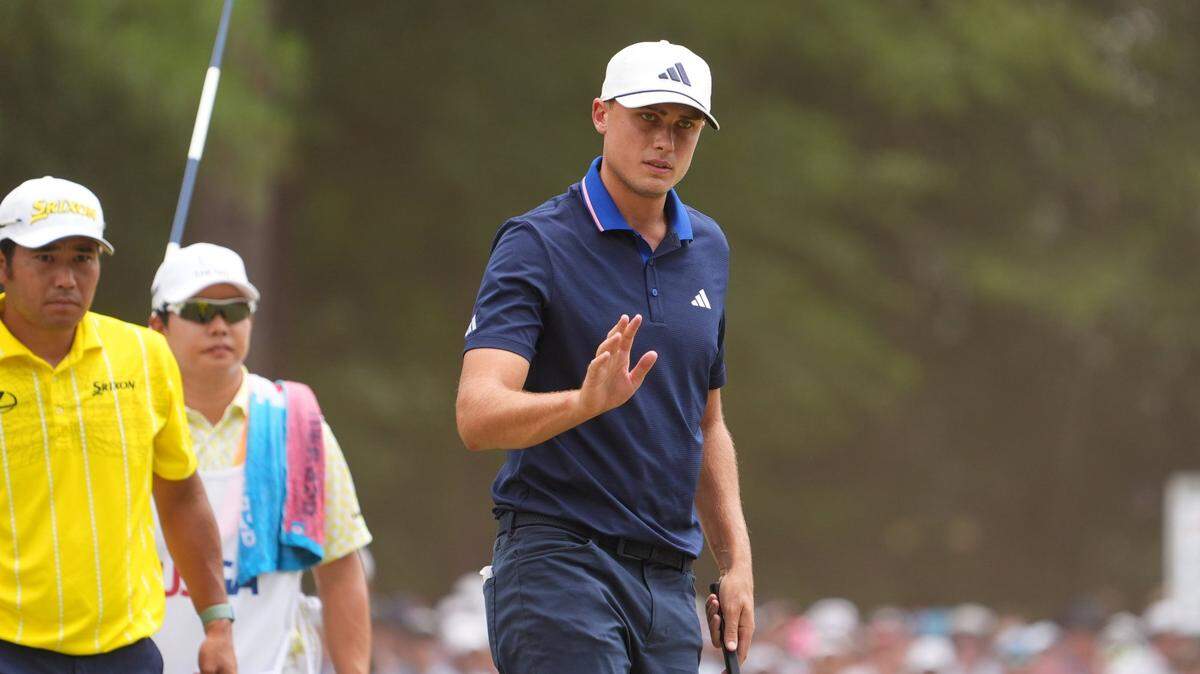Jun 16, 2024; Pinehurst, North Carolina, USA; Ludvig Aberg acknowledges the gallery on the first green during the final round of the U.S. Open golf tournament. Mandatory Credit: John David Mercer-USA TODAY Sports