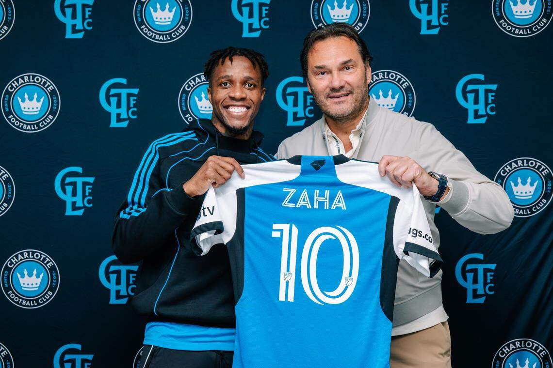 Charlotte FC signs left winger and Premier League star Wilfried Zaha (left) ahead of the 2025 MLS season. The deal was spearheaded by general manager Zoran Krneta (right).