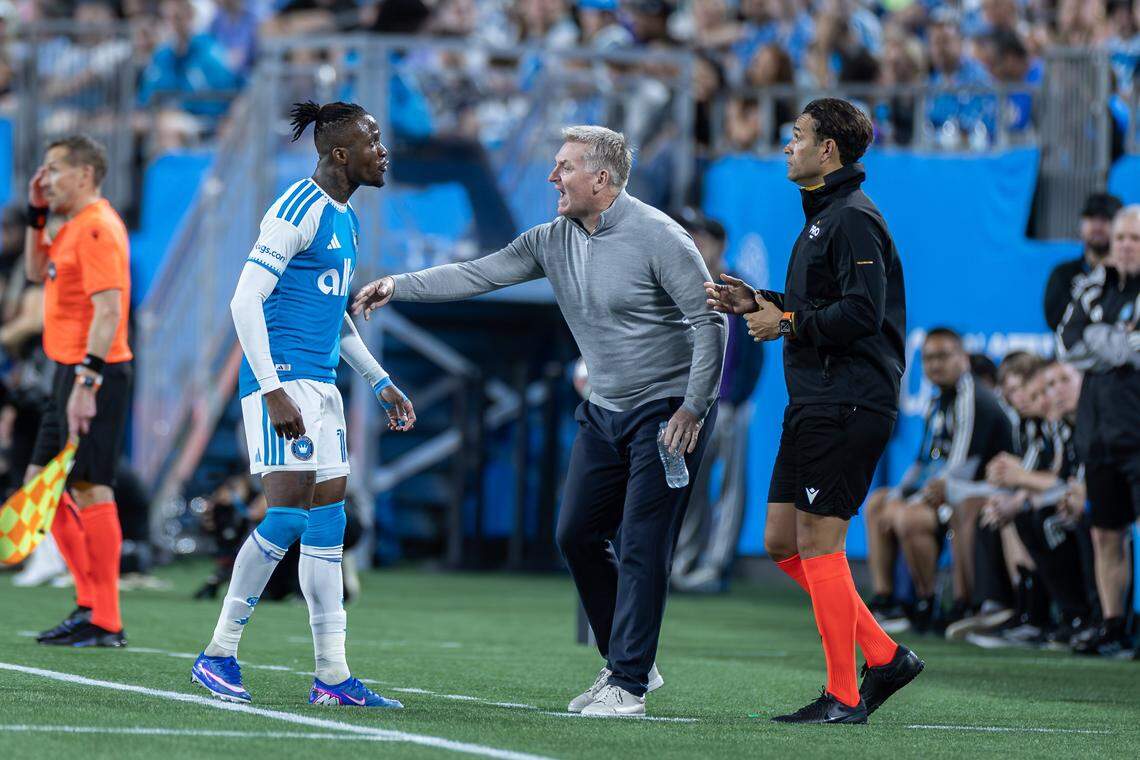 Charlotte FC head coach Dean Smith (center) has an animated discussion with forward Wilfried Zaha (left). Charlotte FC would win their home opener against Austin 3-1 Saturday March 7, 2026.