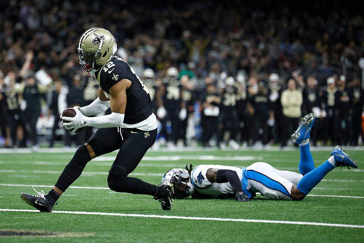 Chris Olave of the New Orleans Saints scores a touchdown against Jaycee Horn of the Carolina Panthers during Sunday’s fourth quarter at Caesars Superdome.