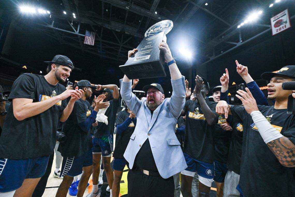 Queens head coach Grant Leonard celebrates after the Royals won the Atlantic Sun championship on Sunday. The win over Central Arkansas gave Queens its first-ever berth in the NCAA tournament.