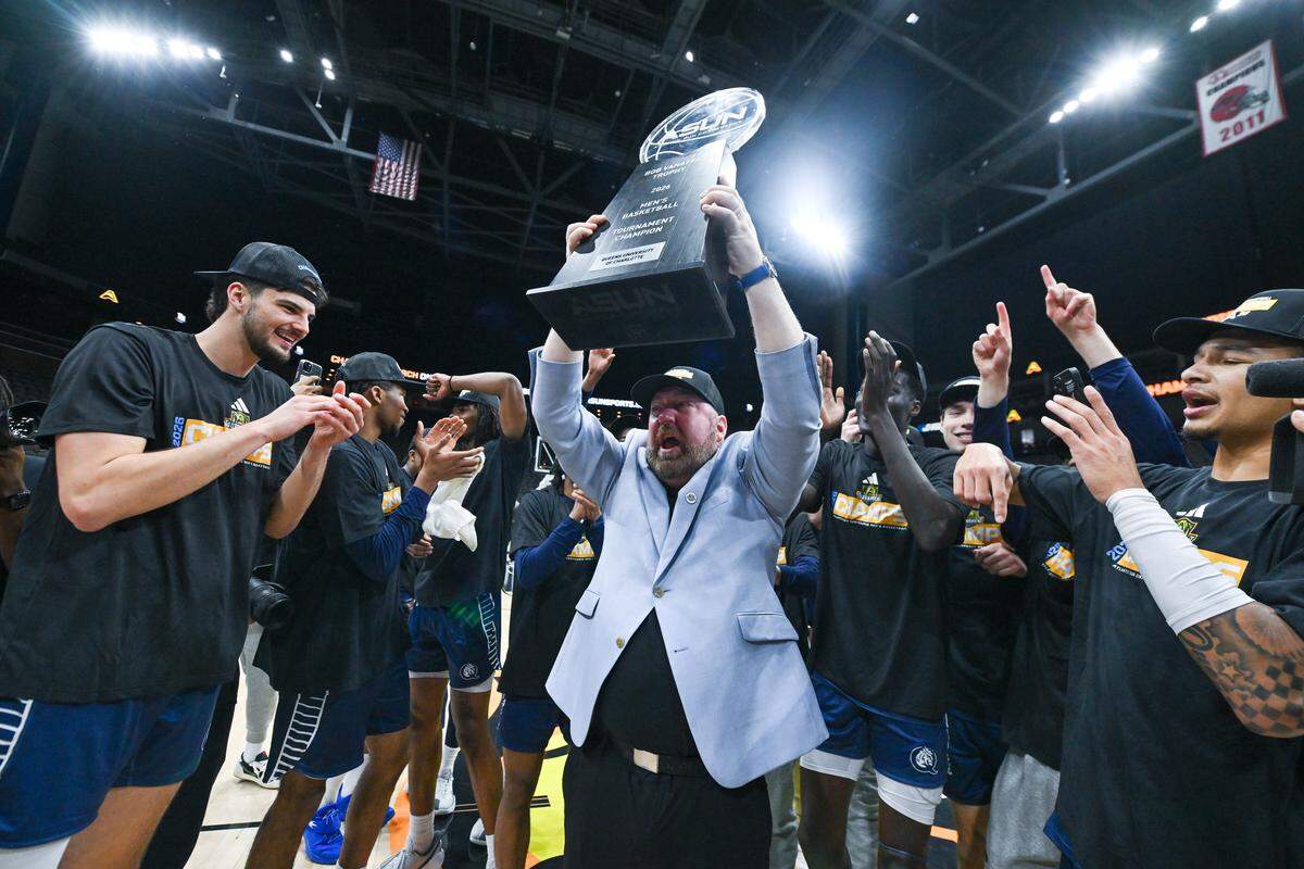 Queens head coach Grant Leonard celebrates after the Royals won the Atlantic Sun championship on Sunday, March 8, 2026 in Jacksonville, Fla. The win over Central Arkansas gave Queens its first-ever berth in the NCAA tournament.