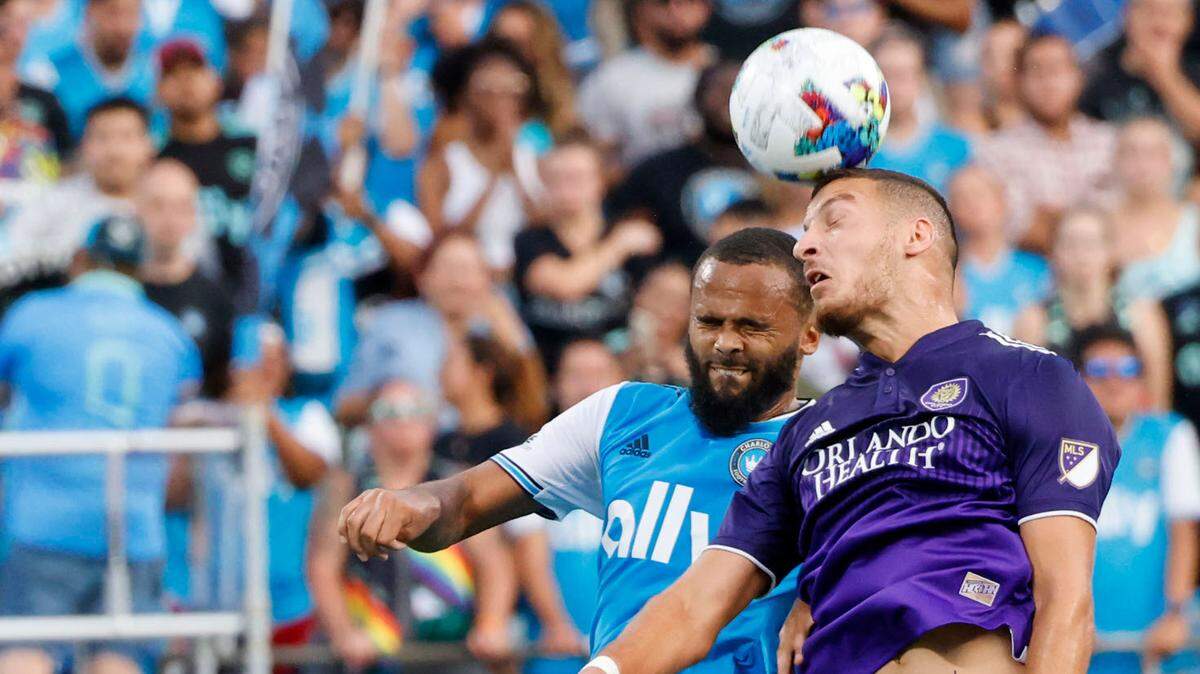 Charlotte FC defender Anton Walkes, left, and Orlando City forward Ercan Kara jump to control the ball in Charlotte, last August.