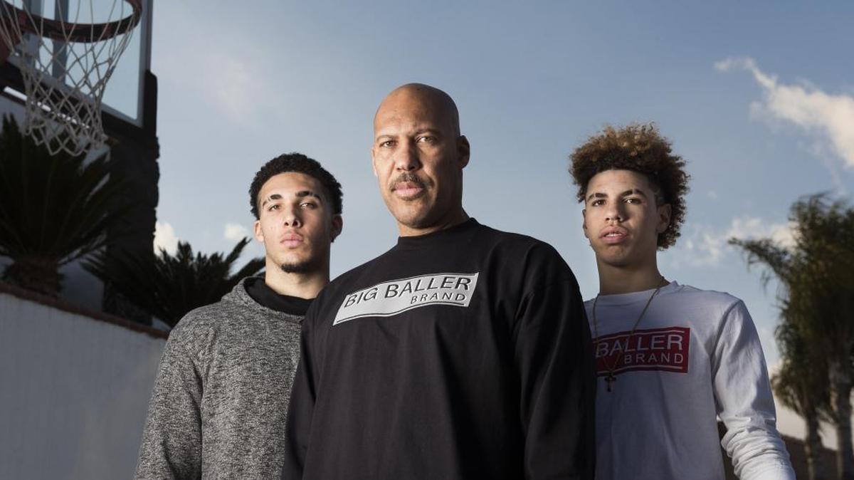 LaVar Ball, center, with his sons and Chino Hill High School basketball stars, LiAngelo, left, and LaMelo, right, on Feb. 22, 2017 at their home in Chino Hills, Calif. The family wears the Big Baller Brand line of clothing that LaVar started. (Leonard Ortiz/Orange County Register/TNS)