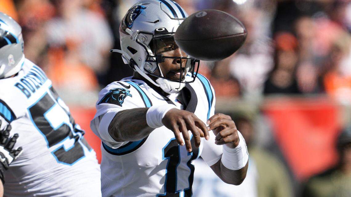 Carolina Panthers quarterback PJ Walker (11) passes against the Cincinnati Bengals during the first half of an NFL football game, Sunday, Nov. 6, 2022, in Cincinnati. (AP Photo/Jeff Dean)