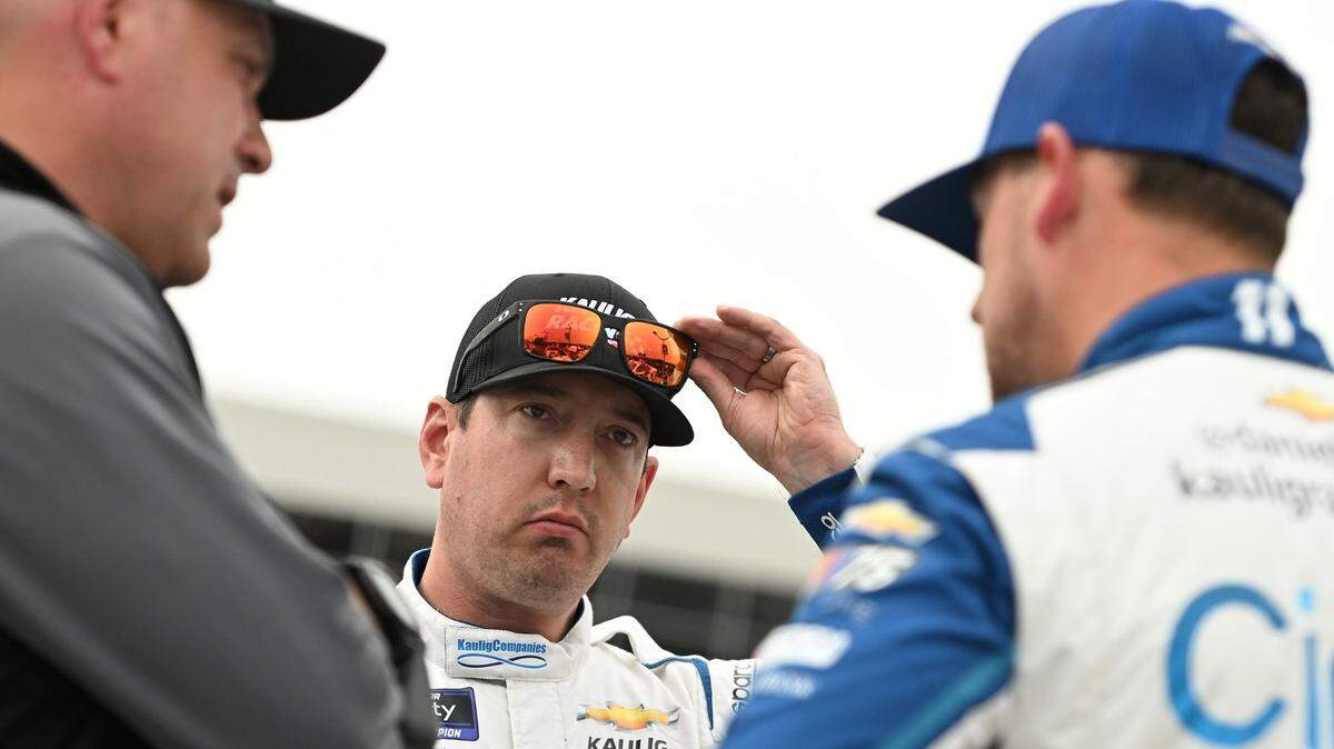 Chris Rice, President of Kaulig Racing, Kyle Busch, driver of the No. 10 LA Golf Chevrolet, and Daniel Hemric, driver of the No. 11 Cirkul Chevrolet, speak on the grid during qualifying for the NASCAR Xfinity Series Alsco Uniforms 300 at Charlotte Motor Speedway on Friday, May 26, 2023, in Concord, North Carolina. (Logan Riely/Getty Images/TNS)