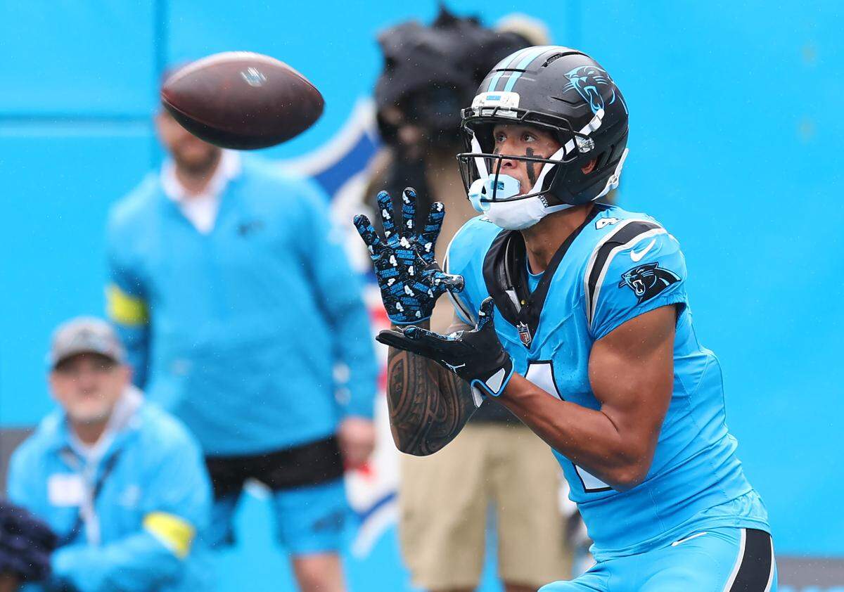 Carolina Panthers wide receiver Tetairoa McMillan prepares to catch a touchdown pass from quarterback Bryce Young during action against the Dallas Cowboys on Oct. 12, 2025, at Bank of America Stadium.