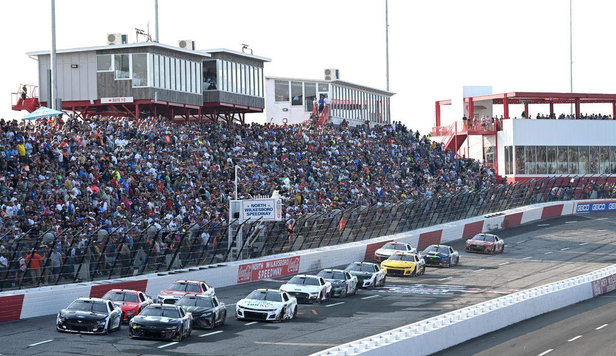 NASCAR Cup Series drivers taking Turn 1 at North Wilkesboro Speedway in 2023. “The Chase” marks a return to a postseason format longtime fans of the sport were hoping for.