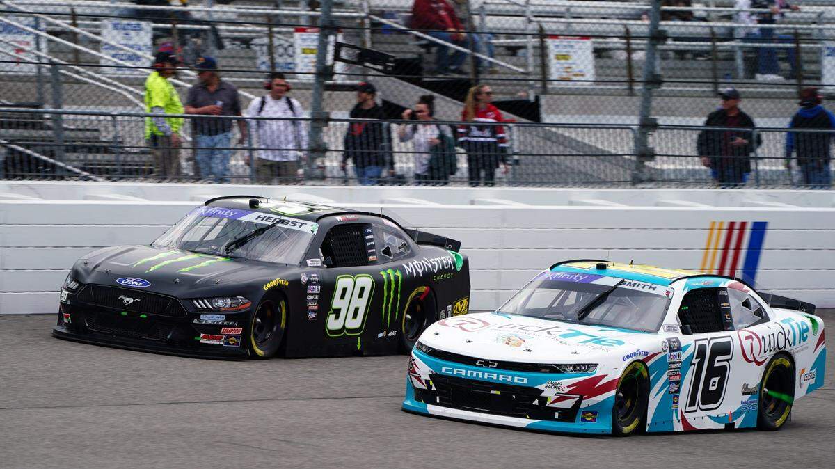Apr 1, 2023; Richmond, Virginia, USA; Xfinity Series driver Riley Herbst (98) races Xfinity Series driver Chandler Smith (16) during the ToyotaCare 250 at Richmond Raceway. Mandatory Credit: John David Mercer-USA TODAY Sports