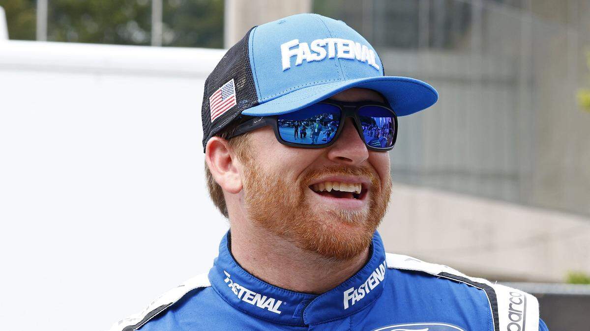 Jul 1, 2023; Chicago, Illinois, USA;NASCAR Cup Series driver Chris Buescher (17) in the garage area along Grant Park during practice and qualifying for the Chicago Street Race. Mandatory Credit: Mike Dinovo-USA TODAY Sports