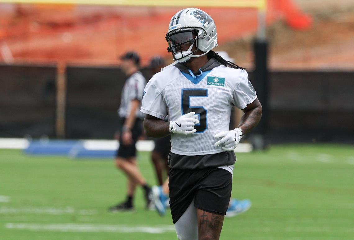 Panthers running back Rico Dowdle, wearing No. 5, practices during the first day of minicamp on June 10.